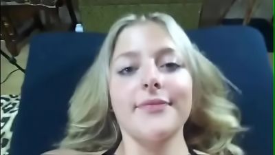 A young girl with blue eyes and natural blonde hair from next door engages in hardcore sex in a porn video