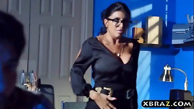 MILF teacher shows a porn movie in class and fucks a student