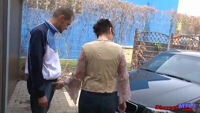 Elderly woman having sex in a public place with a sexually aroused young man