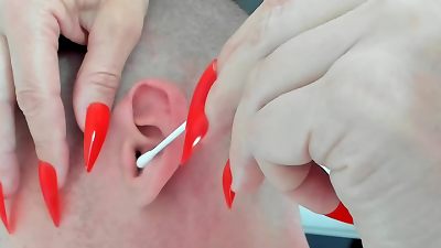 Older woman dominatrix with long nails gives sensual massage with ASMR twist