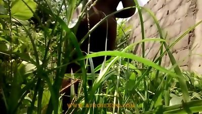 ebony latina in the middle of the grass