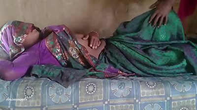 Indian woman's saree is penetrated on a bed in a real Indian sex video