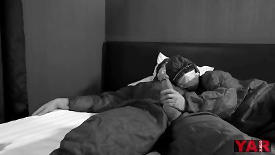 an infectious disease medic in a protective suit milks off a thick lollipop to a colleague