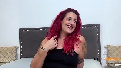 Elektra Red, a voluptuous redhead, enjoys a steamy encounter with a well-endowed partner