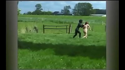 An older woman is subjected to punishment by her dominant mistress while being completely naked