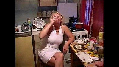 A mother having sex with her son in the kitchen