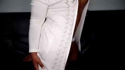 Arousing and passionate black woman entices you from the living room sofa