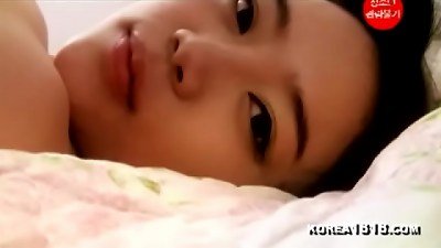 Korean woman with large breasts in a porn video.
